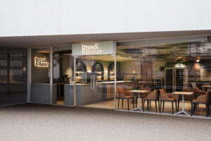 Modern café fitout in Canberra featuring acoustic ceiling panels and natural finishes.